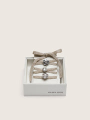 Skins braided gold-colored laces with shimmering charms