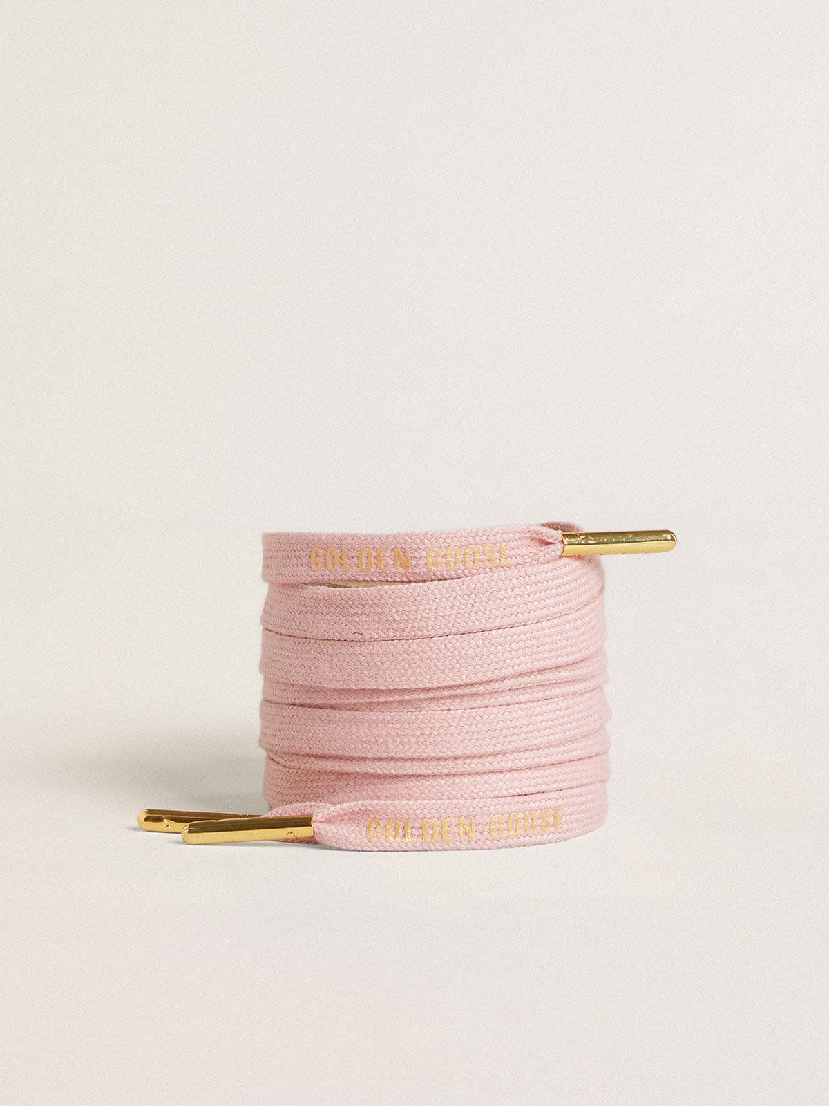Pink cotton laces with contrasting gold logo