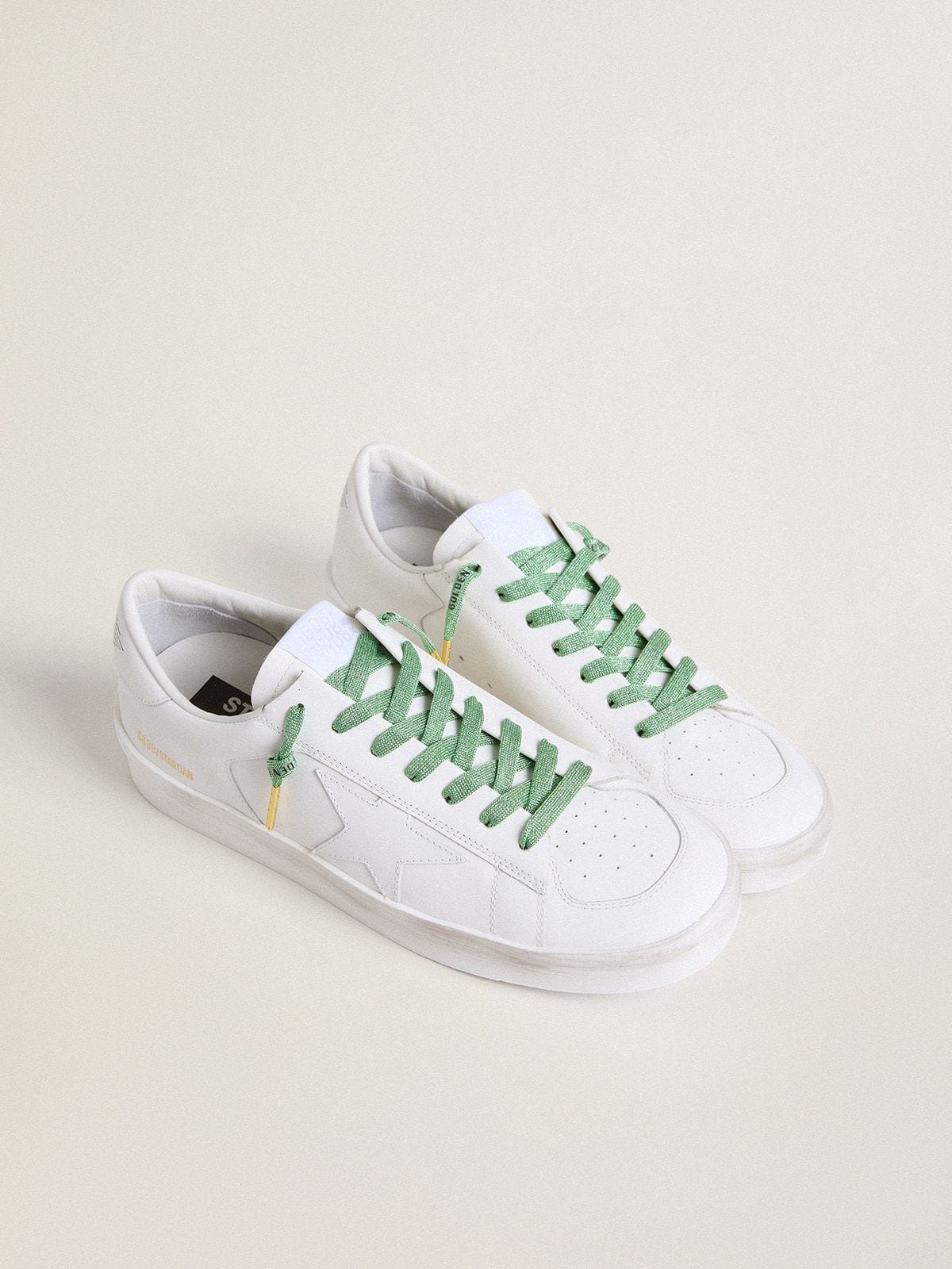 Aqua-green Lurex laces with contrasting black logo