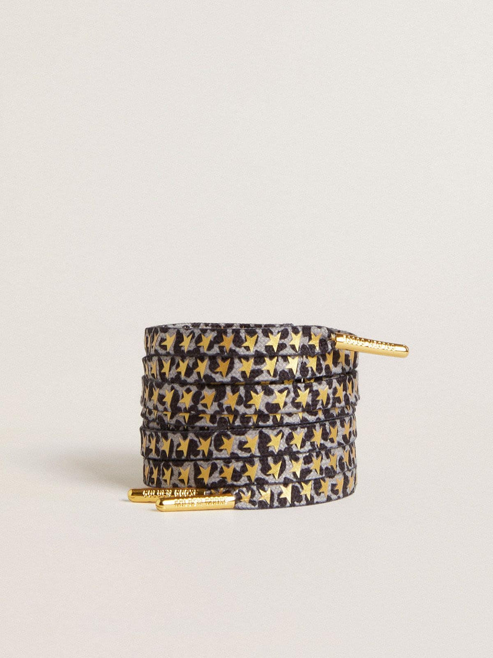 Laces with gray and black animal print with contrasting gold stars