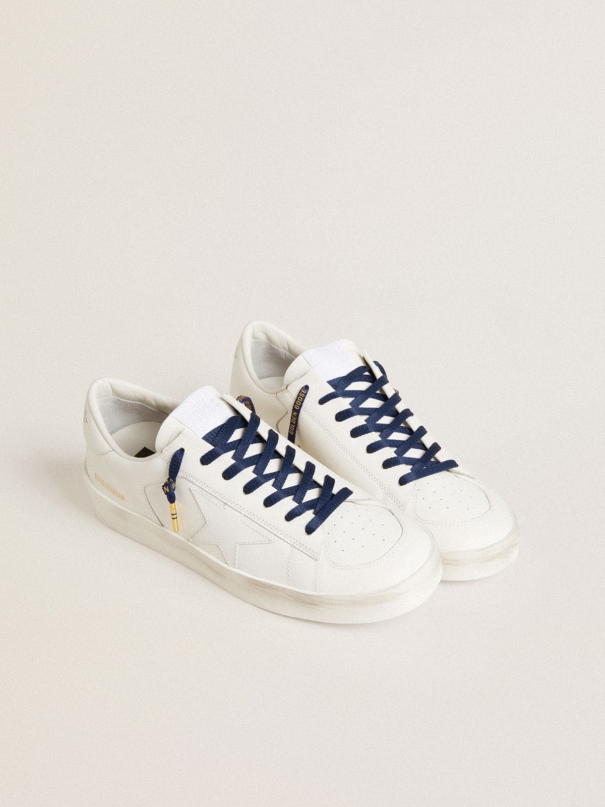 Blue cotton laces with contrasting gold-colored logo