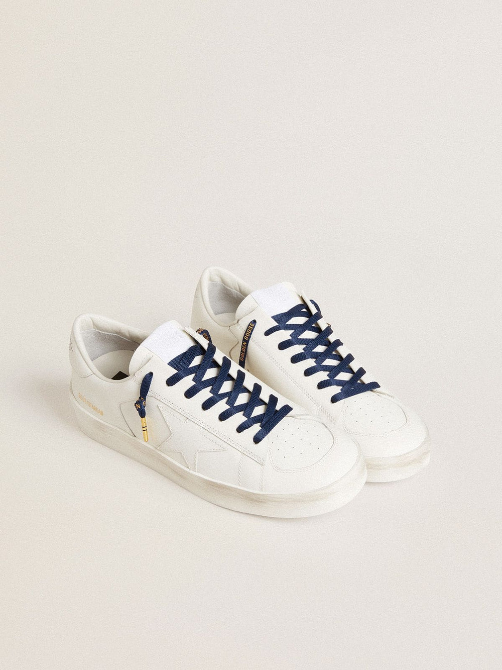 Blue cotton laces with contrasting gold-colored logo
