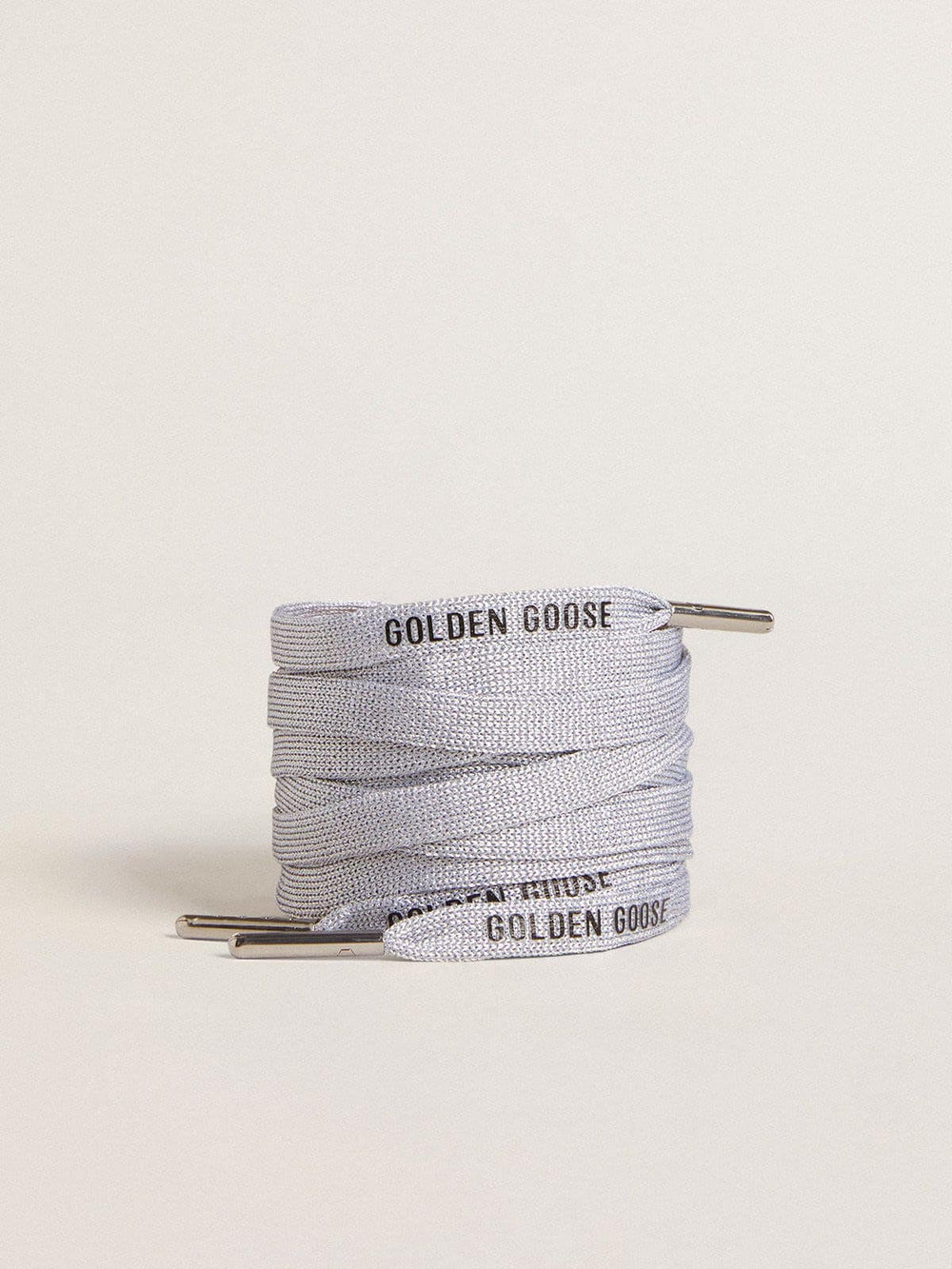 Silver-colored Lurex laces with contrasting black logo