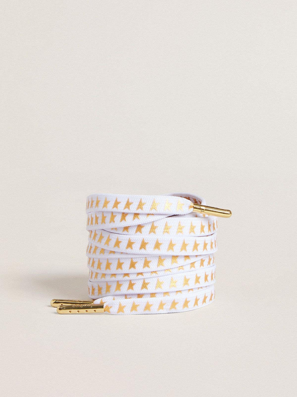 White cotton laces with contrasting gold stars