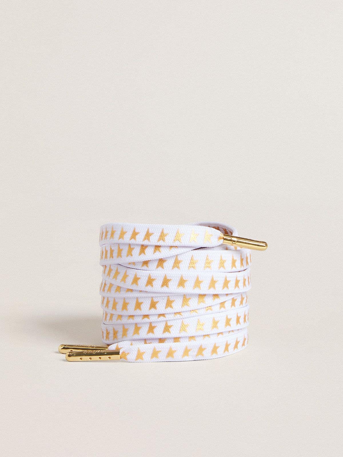 White cotton laces with contrasting gold stars