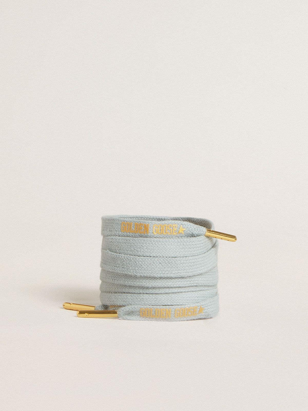 Light-blue cotton laces with contrasting gold-colored logo