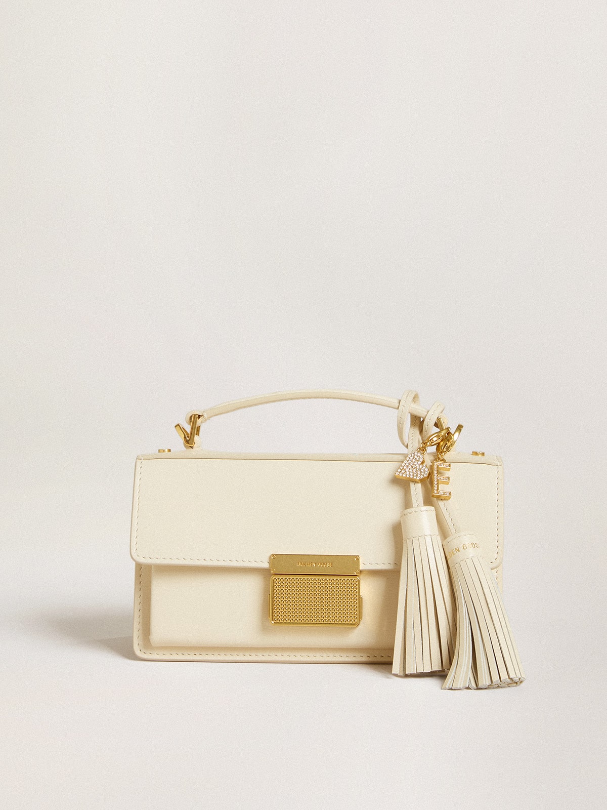 Heart-shaped charm in gold-colored brass with crystals