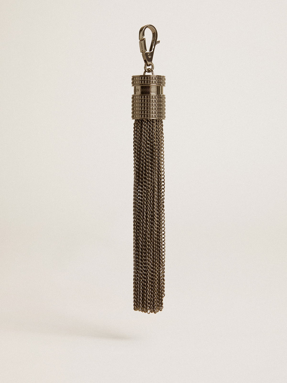 Tassel-shaped charm in silver-colored brass with crystals