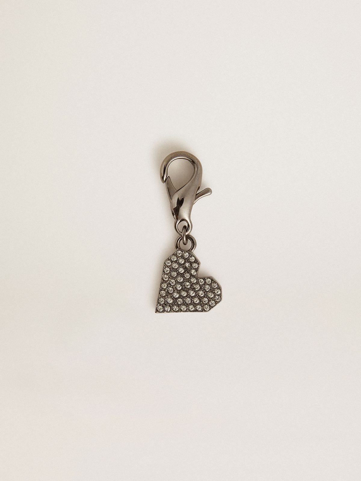 Heart-shaped charm in silver-colored brass with crystals