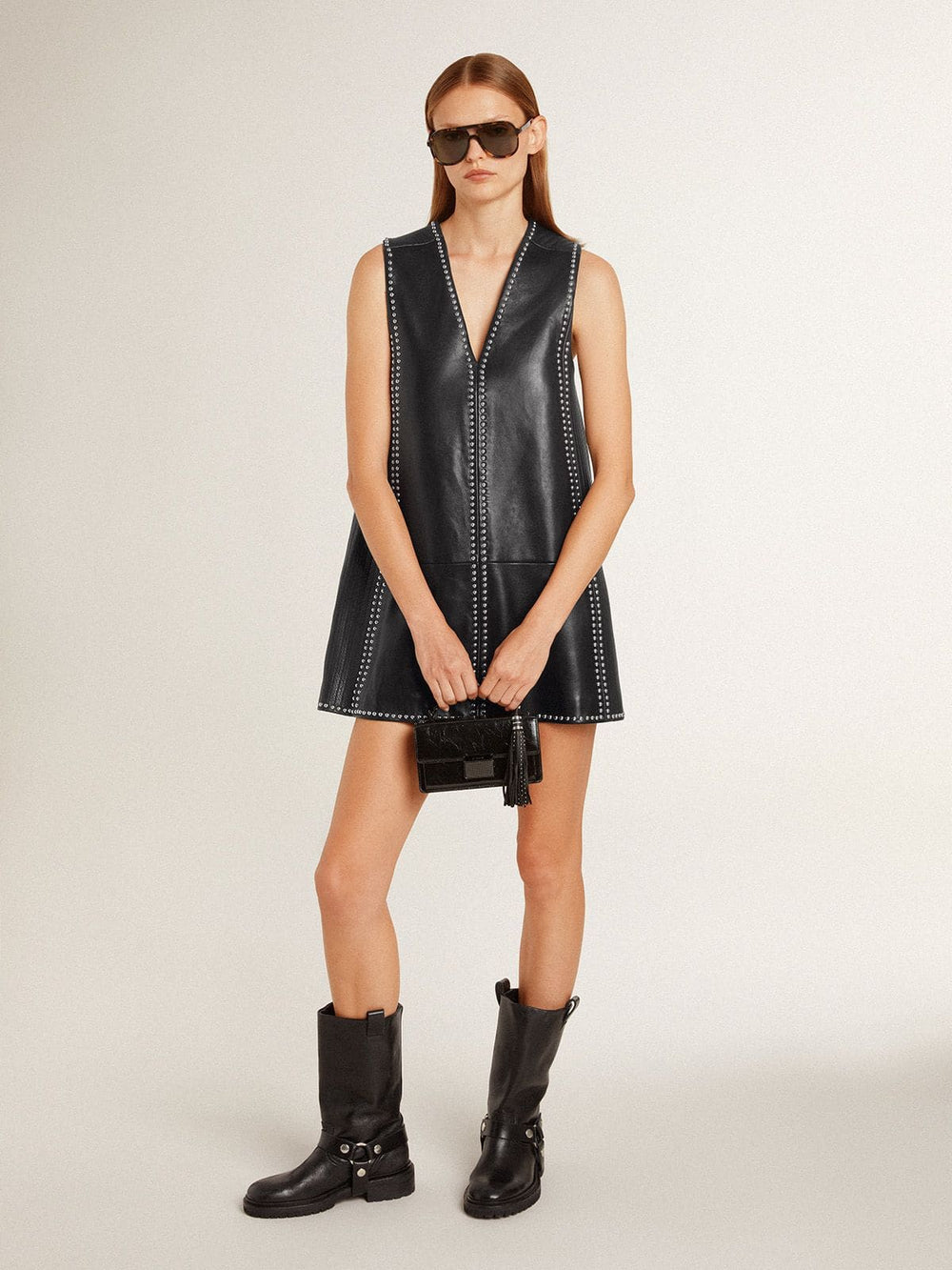 Charm in black nappa leather with studs and metal details