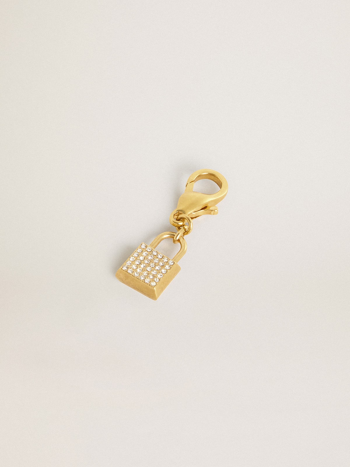 Lock-shaped charm in gold-colored brass with crystals