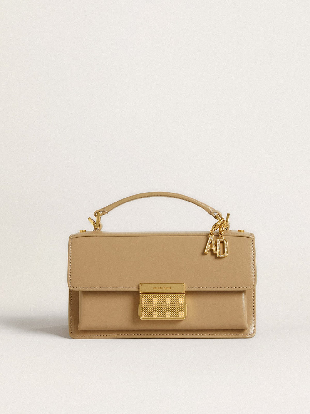 Letter D charm in gold-colored brass with crystals