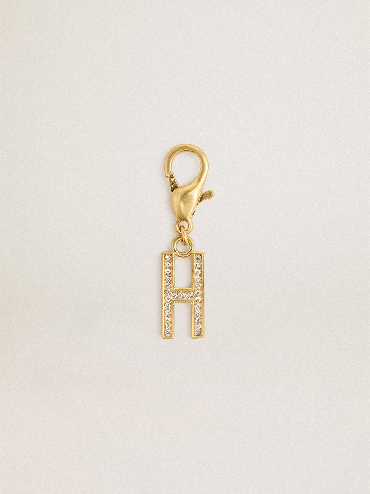Letter H charm in gold-colored brass with crystals