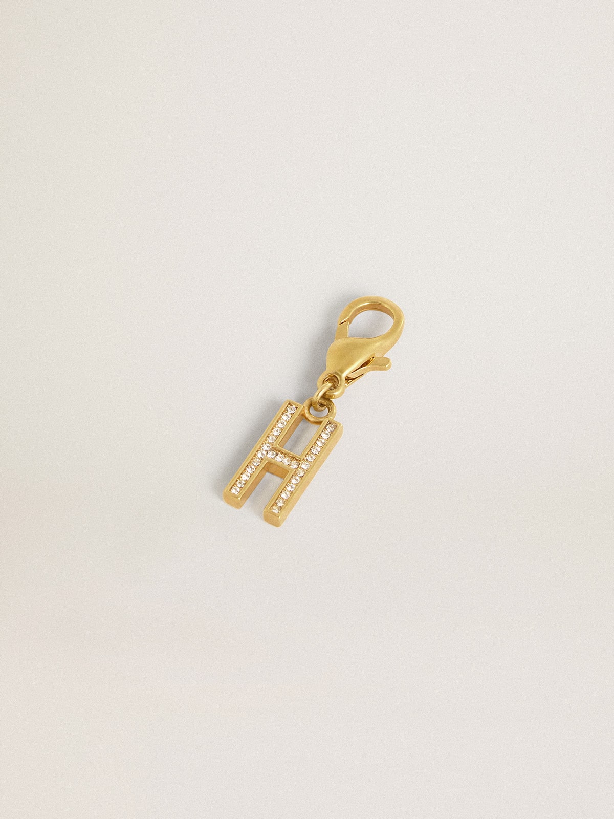 Letter H charm in gold-colored brass with crystals