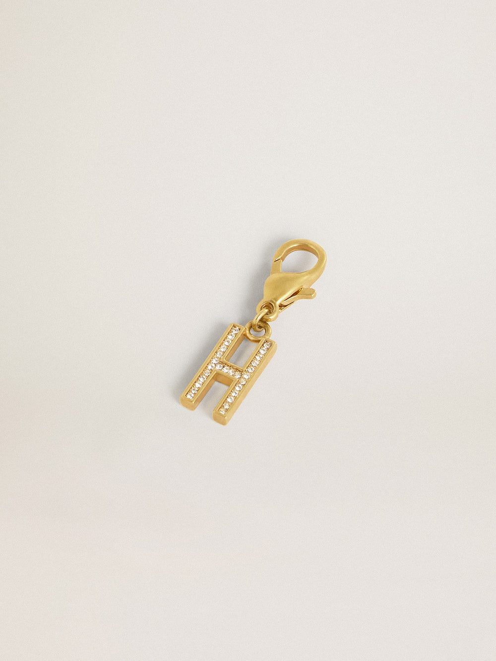Letter H charm in gold-colored brass with crystals