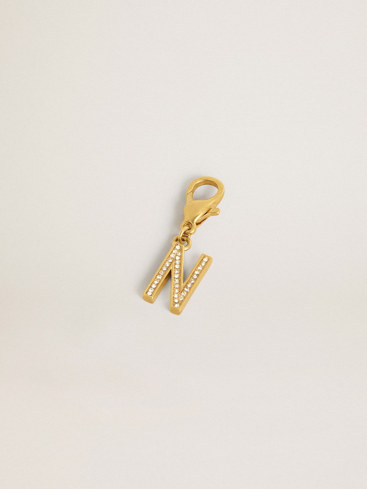 Letter N charm in gold-colored brass with crystals