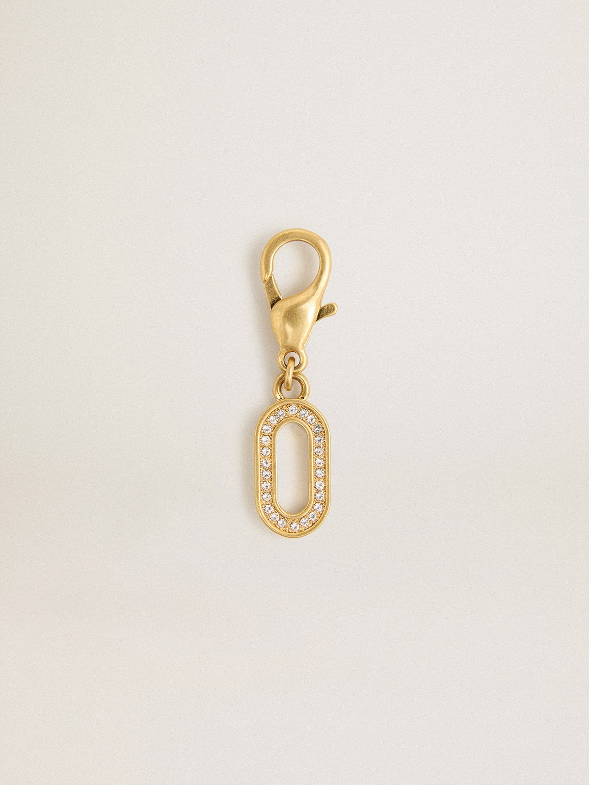 Letter O charm in gold-colored brass with crystals