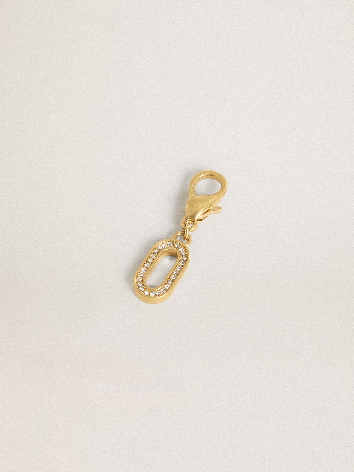 Letter O charm in gold-colored brass with crystals