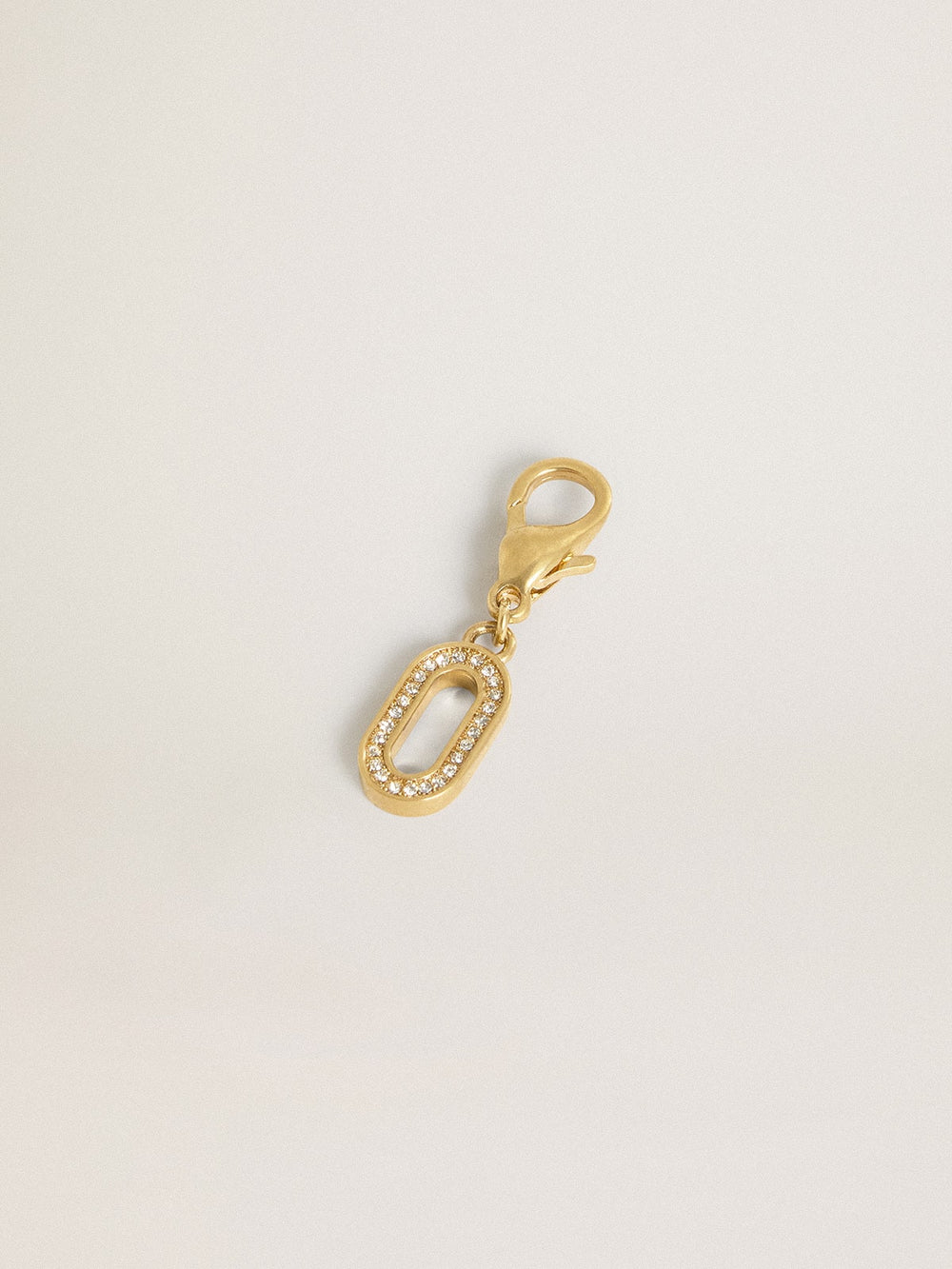 Letter O charm in gold-colored brass with crystals