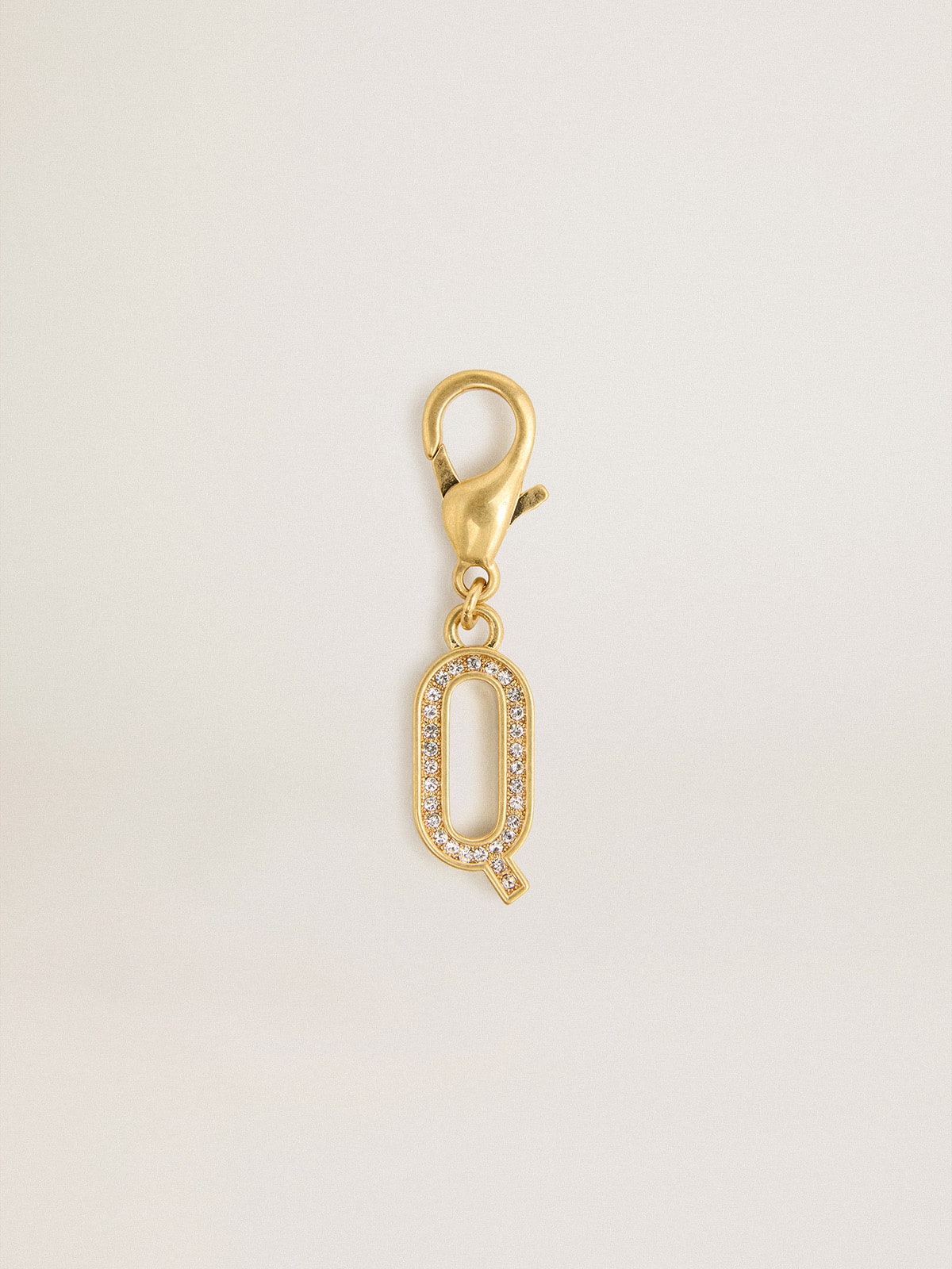 Letter Q charm in gold-colored brass with crystals
