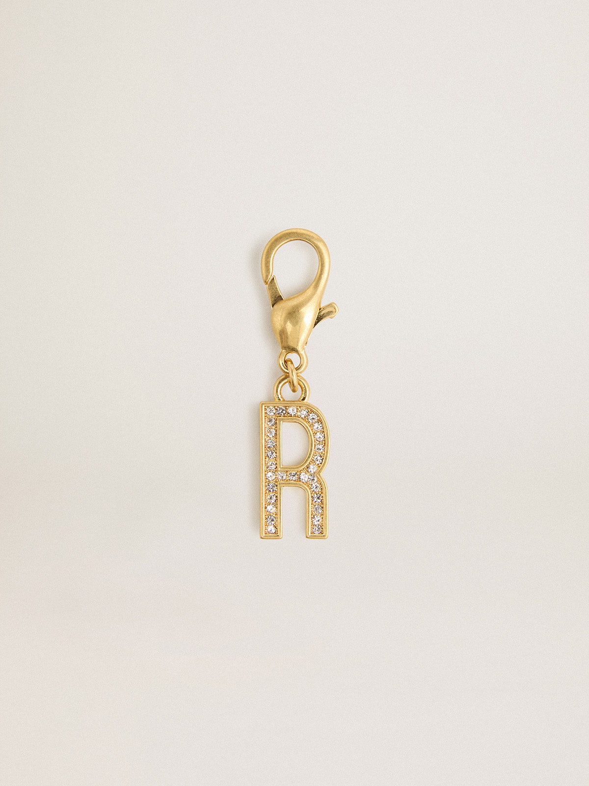 Letter R charm in gold-colored brass with crystals