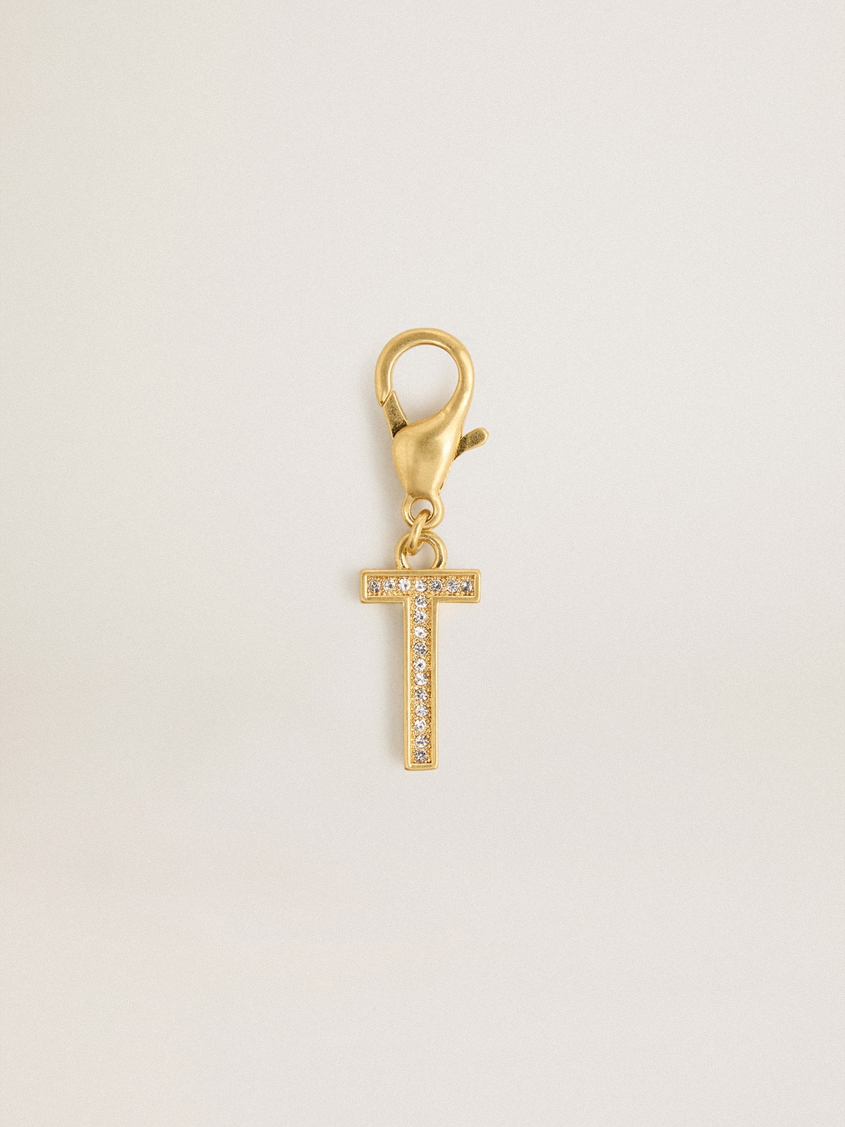 Letter T charm in gold-colored brass with crystals