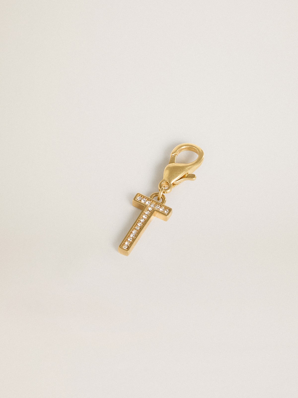 Letter T charm in gold-colored brass with crystals