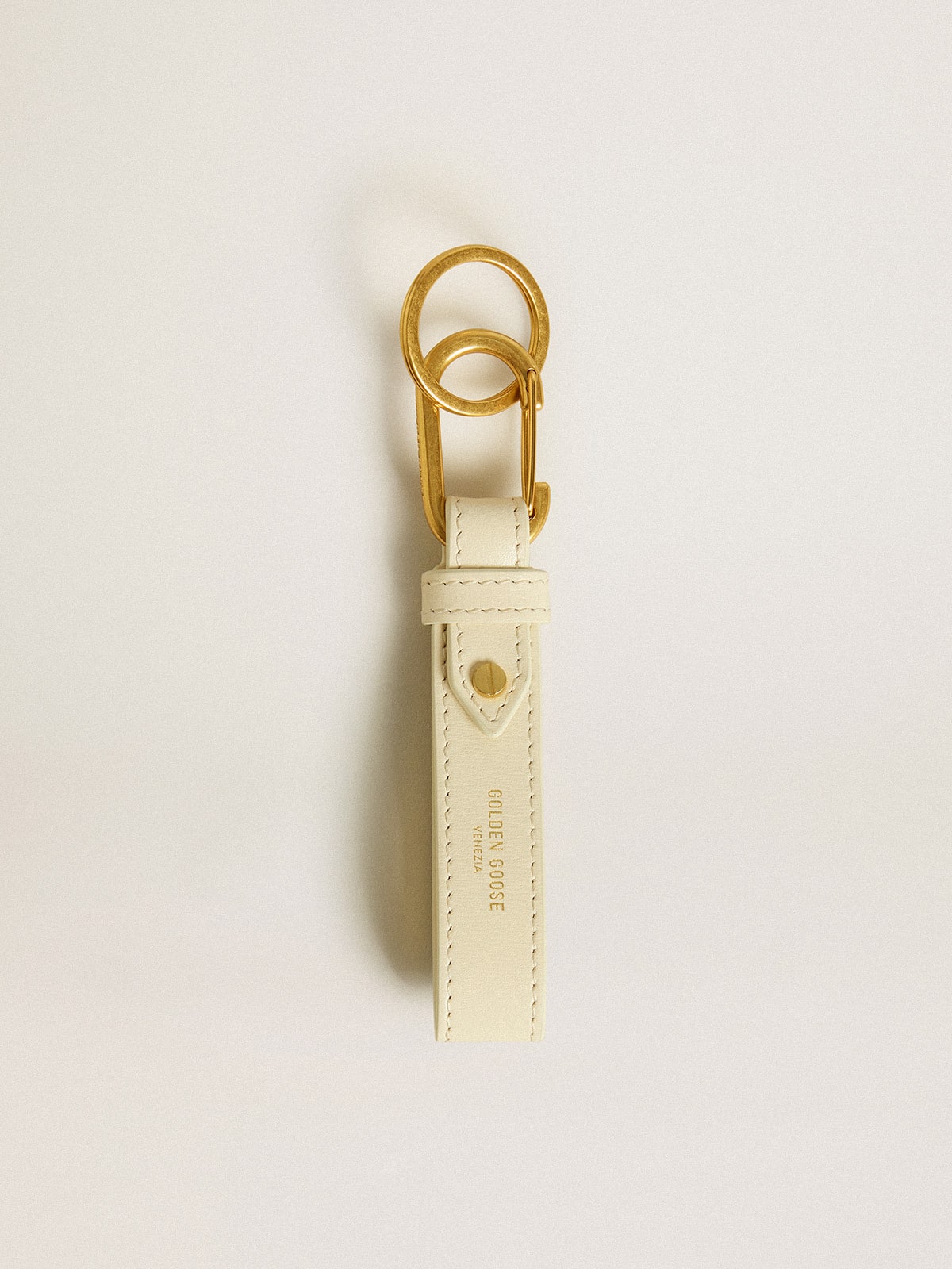 Worn white keyring