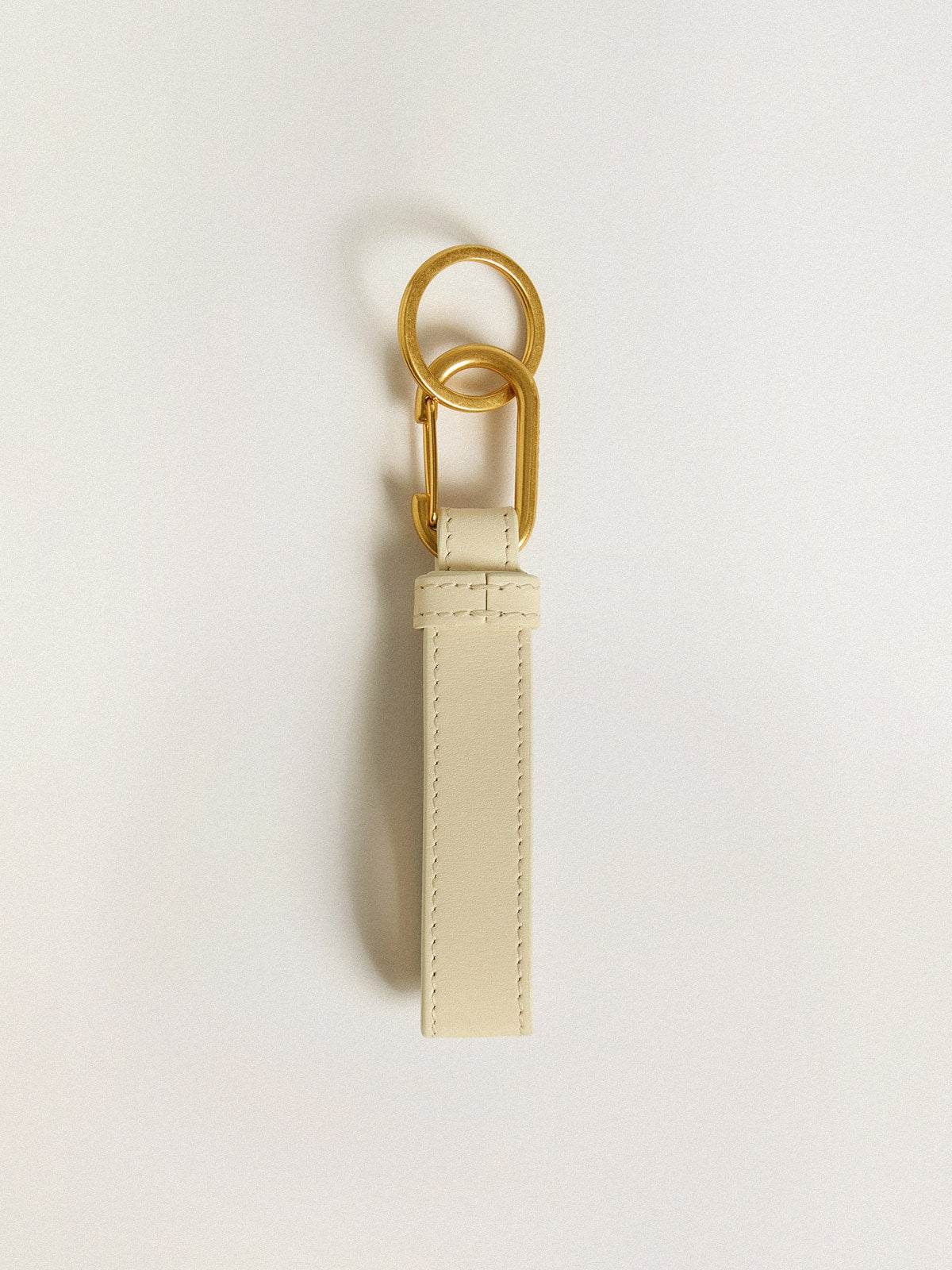 Worn white keyring