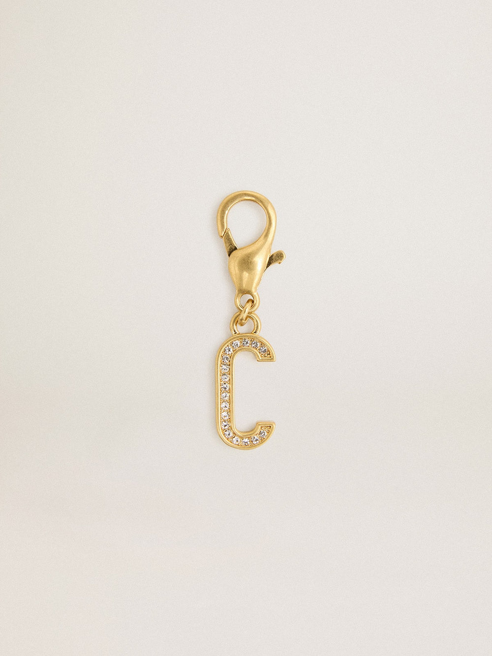 Letter C charm in gold-colored brass with crystals