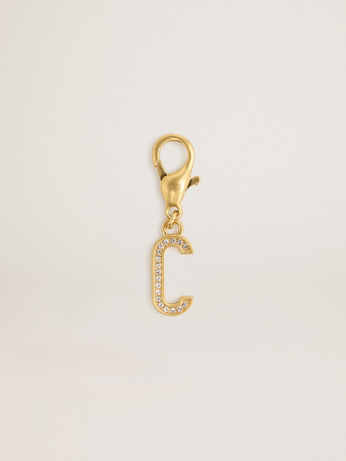 Letter C charm in gold-colored brass with crystals