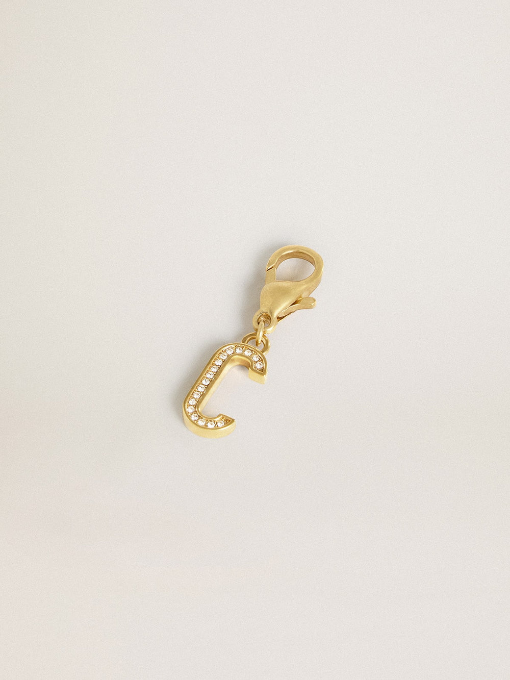Letter C charm in gold-colored brass with crystals