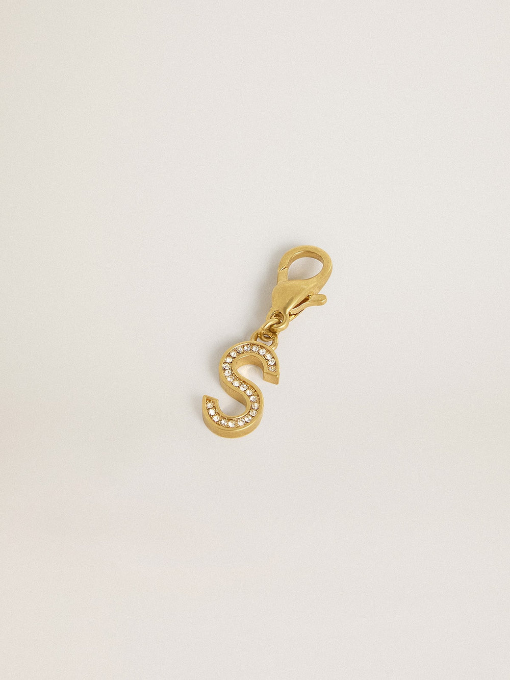 Letter S charm in gold-colored brass with crystals