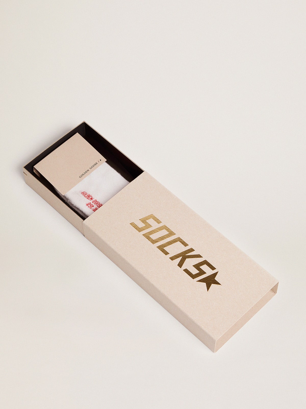 White socks with distressed details and red stripes