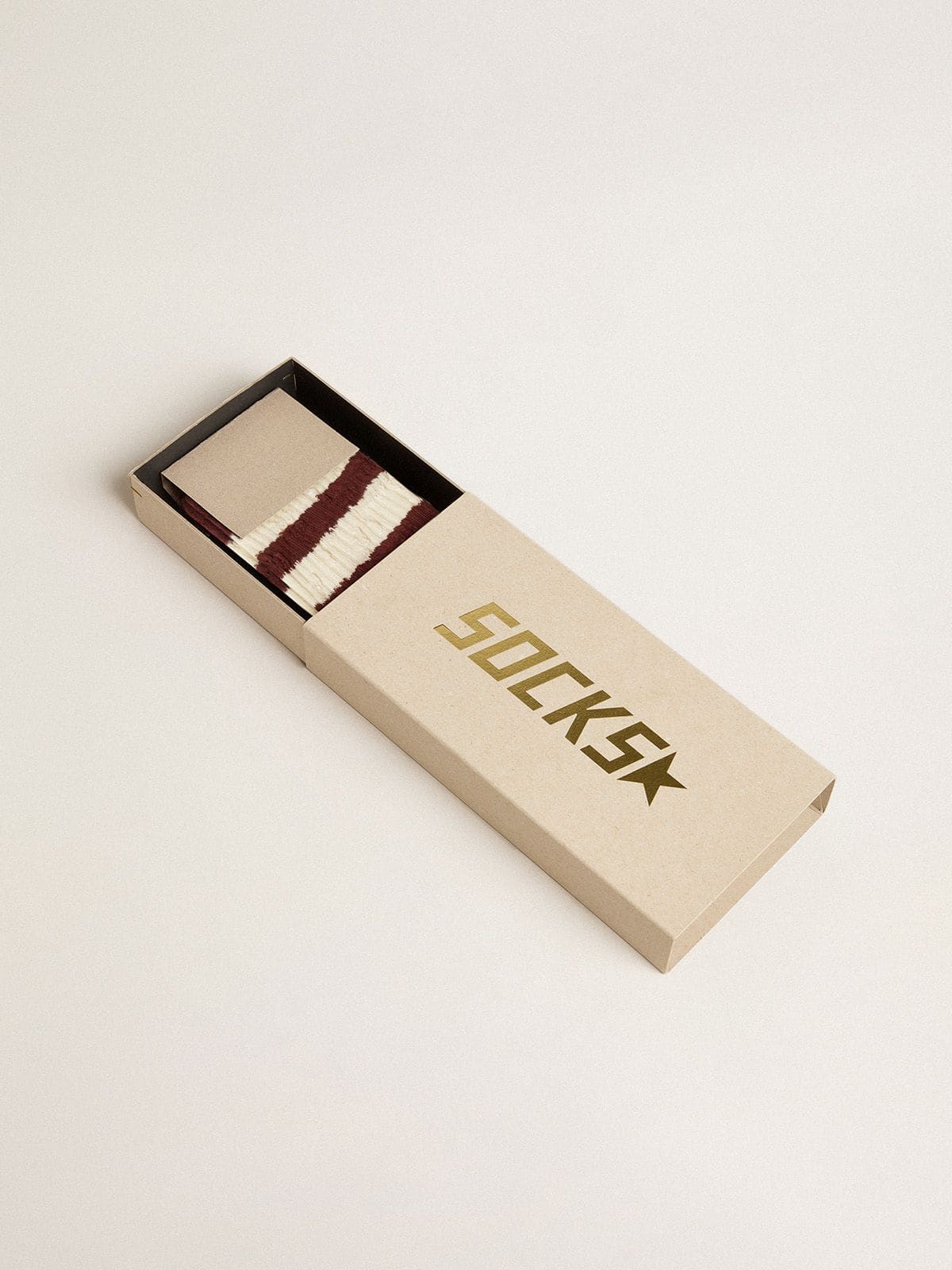 Purple socks with distressed details and worn-white stripes