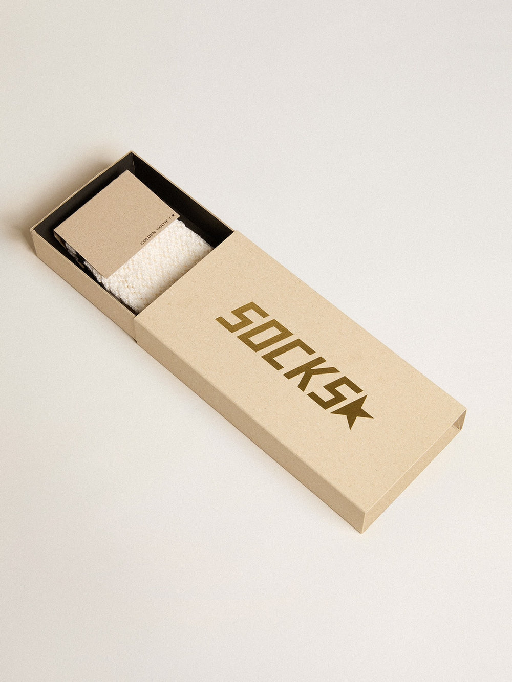 Long ribbed socks in vintage white with black stripe