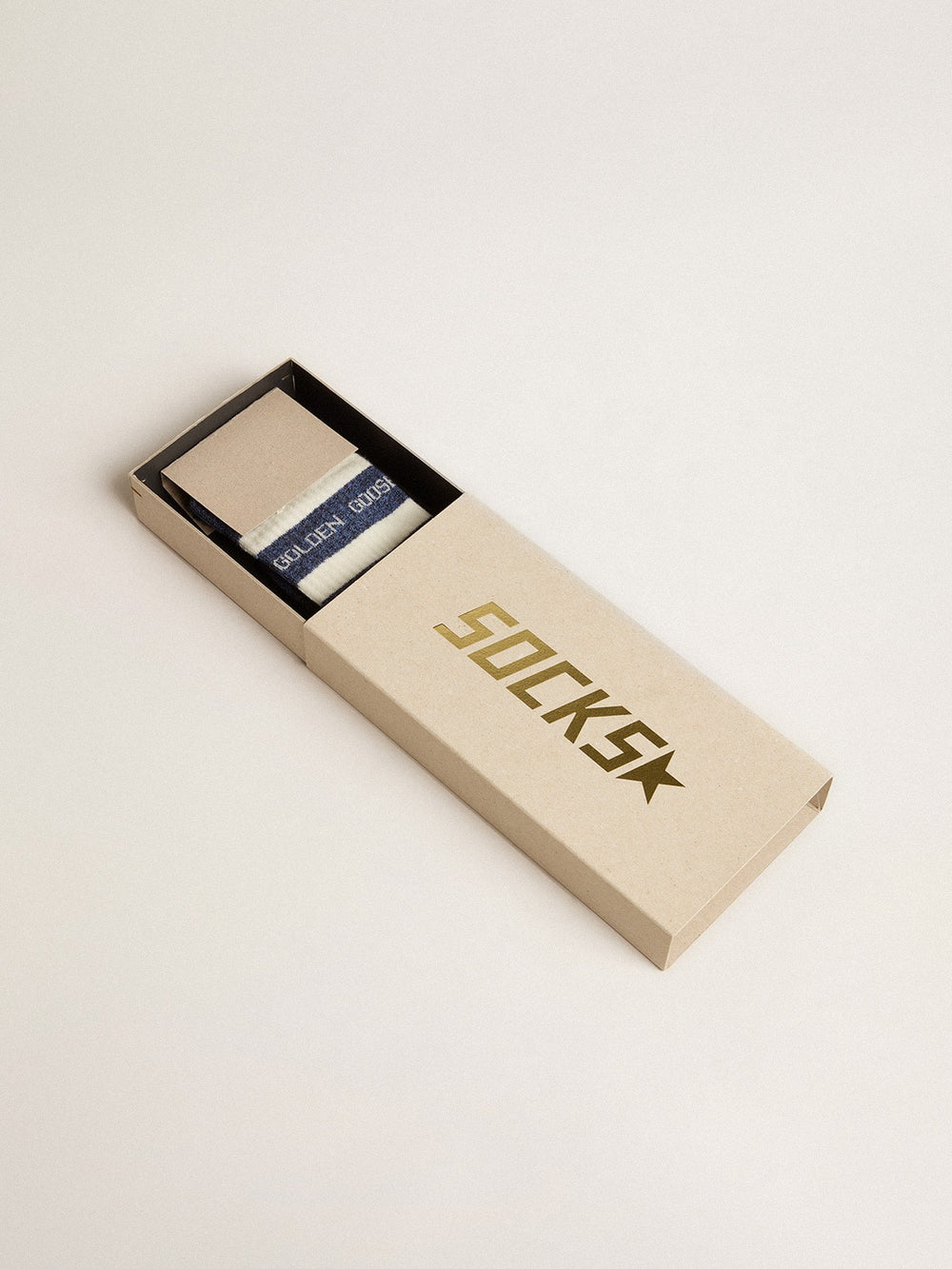 Blue socks with contrasting white stripes and white logo