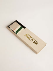 Worn-white socks with distressed details and pink and green stripes