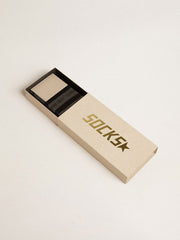 Grey socks with distressed details and black stripes