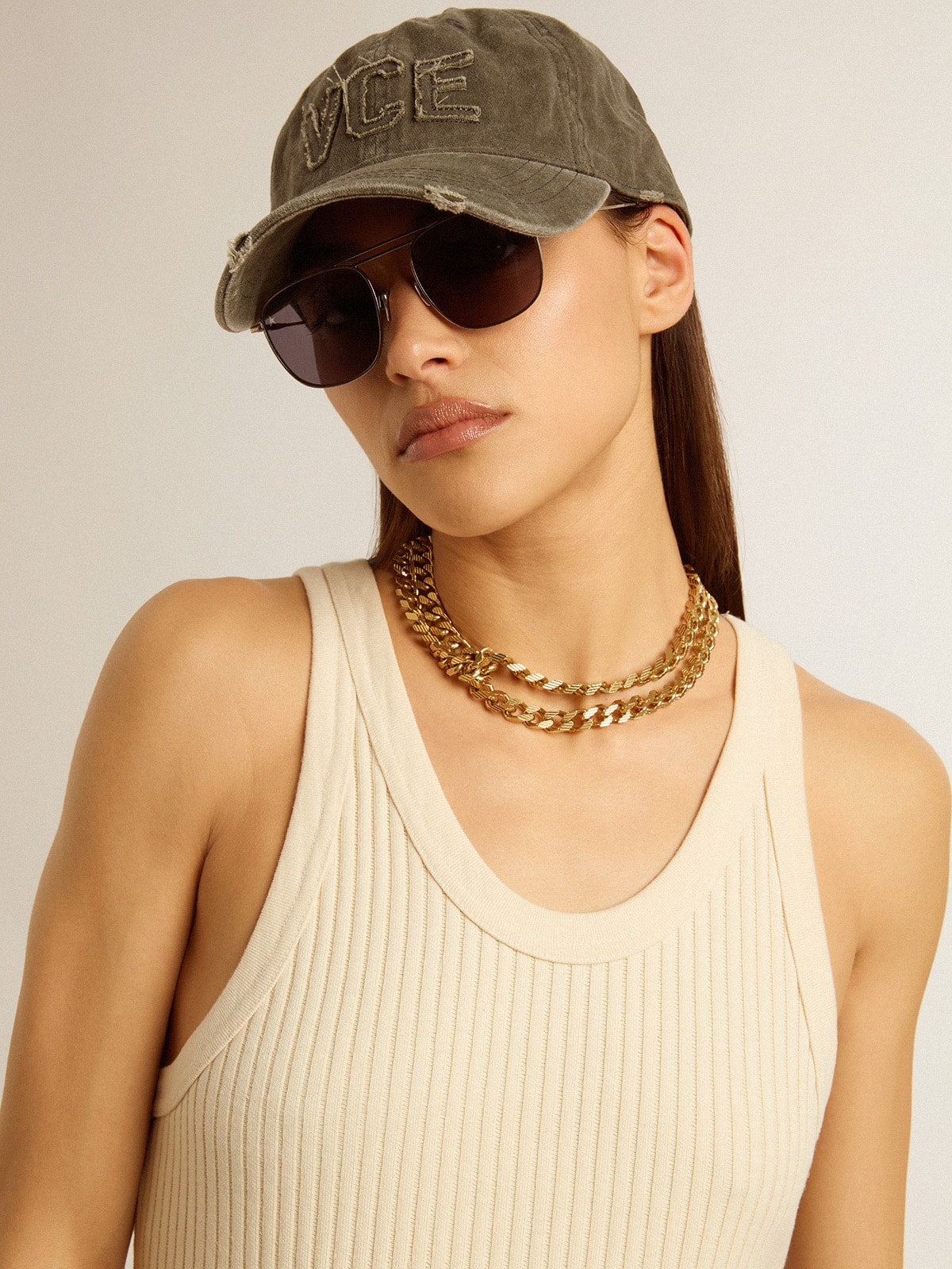 Antique gold-colored braided chain necklace with star-shaped clasp