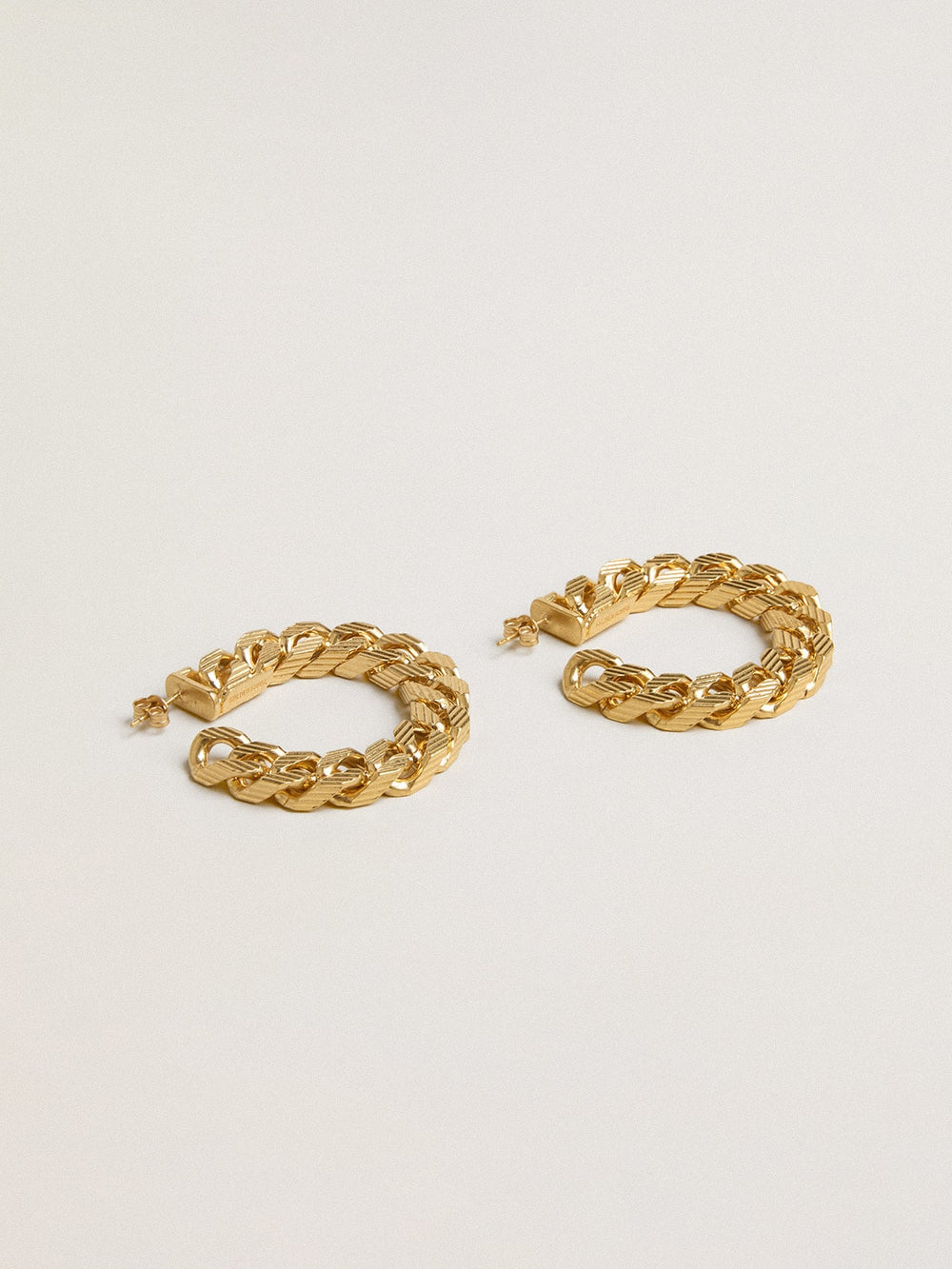 Chain hoop earrings with antique gold colored braided links