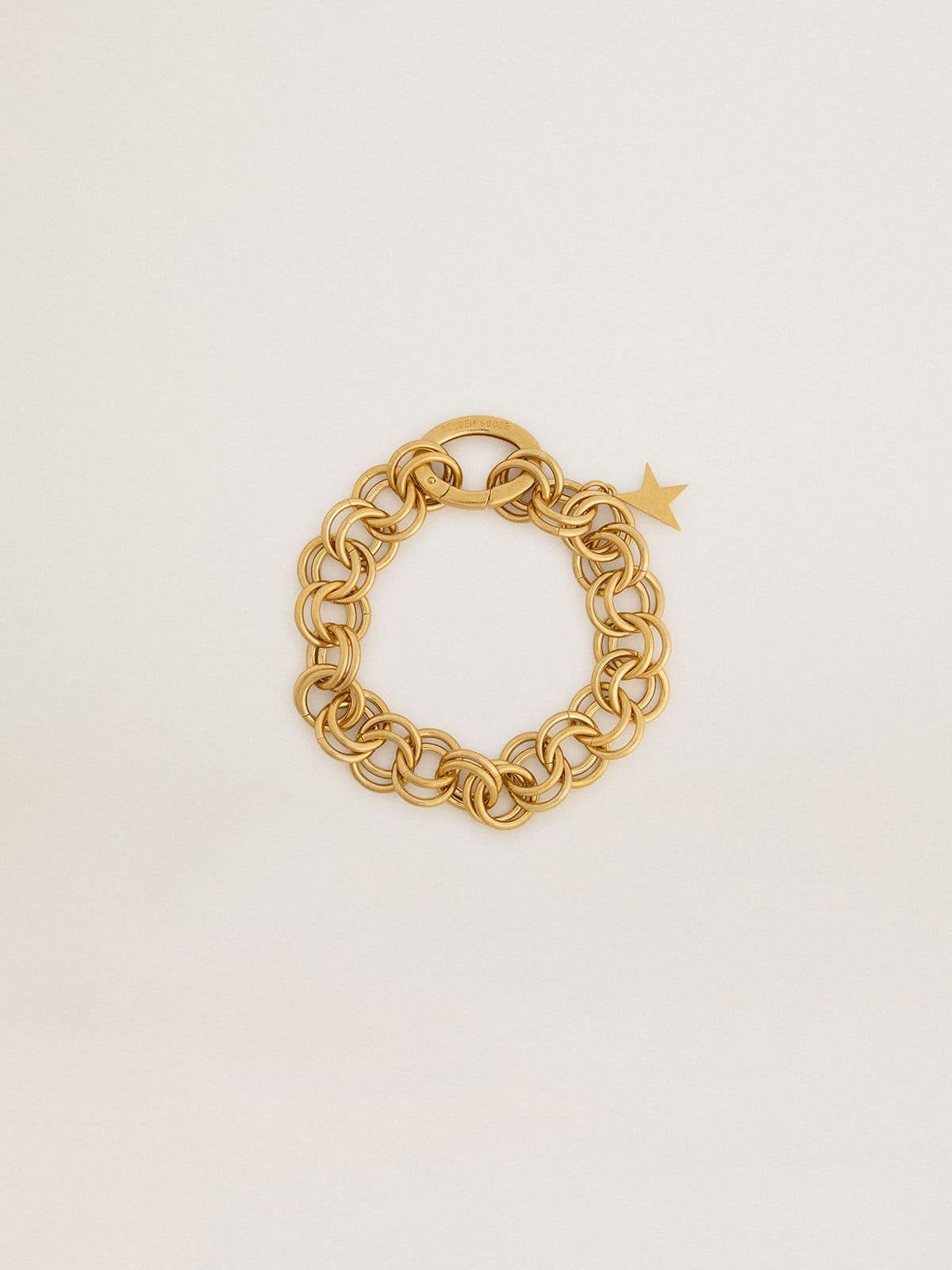 Antique gold-colored woven chain bracelet with star-shaped clasp