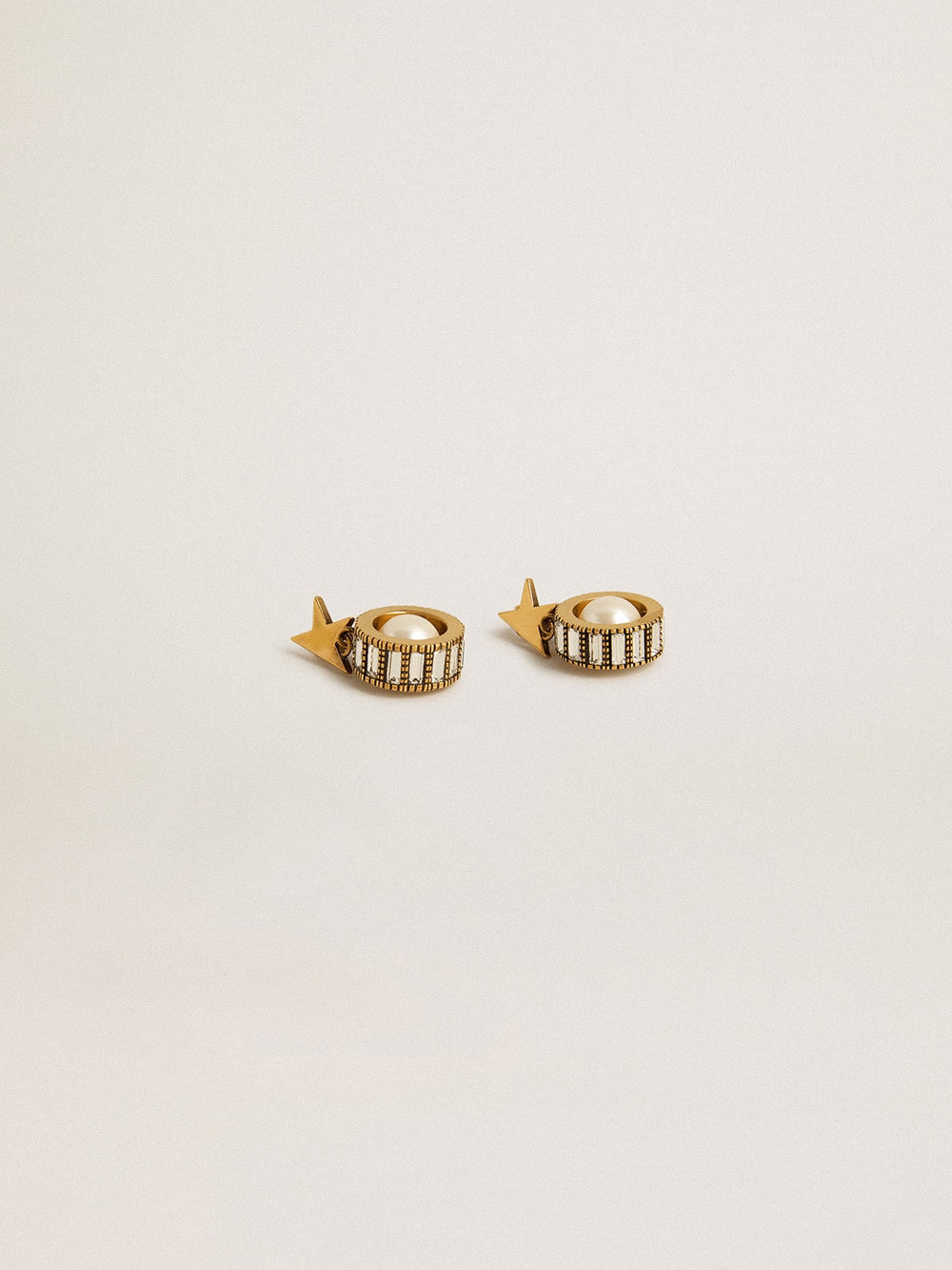 Earrings with gold star and pearl