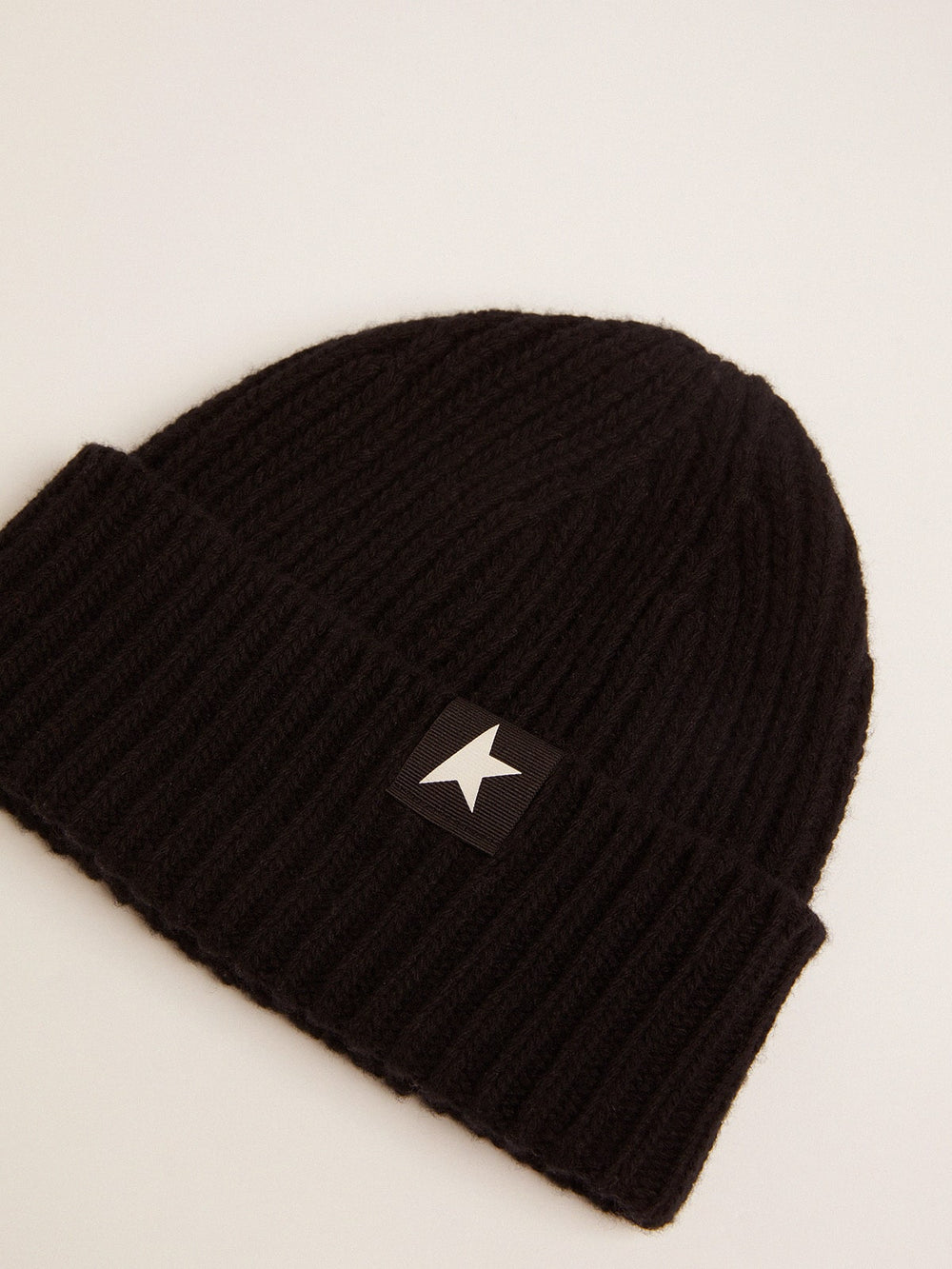 Black wool beanie with white star