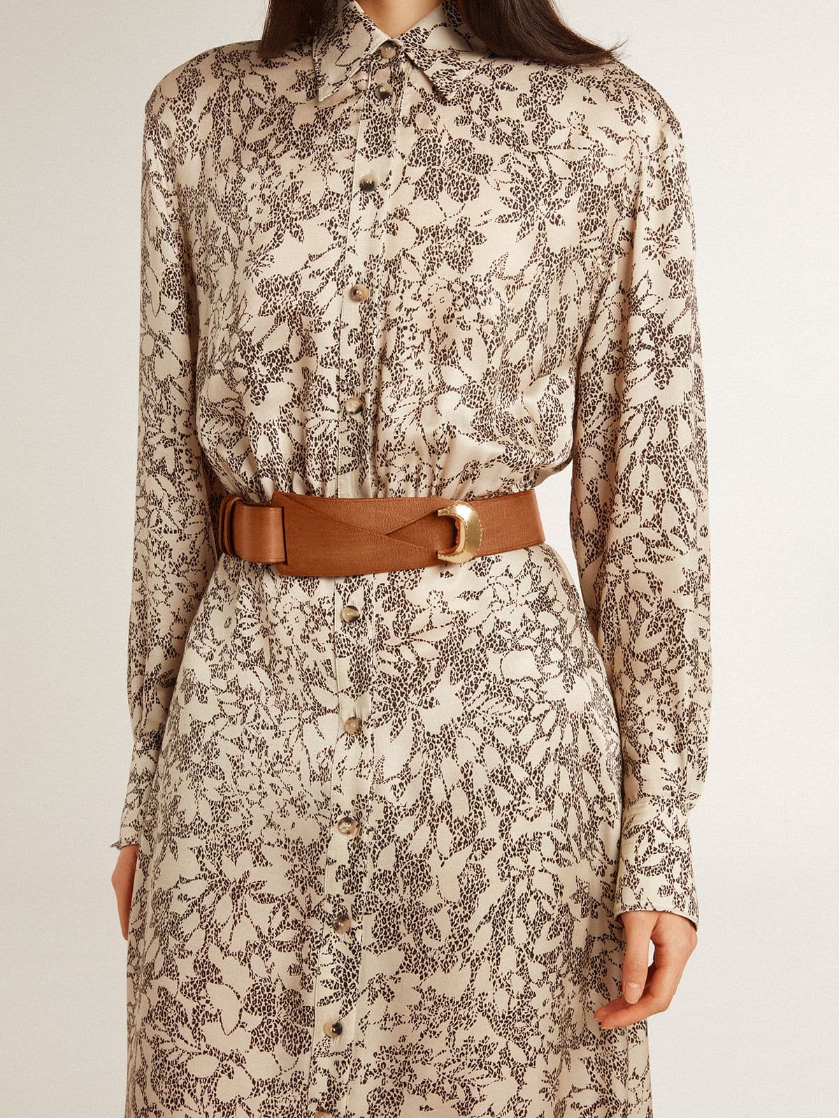 Brown leather belt with semi-circular gold buckle