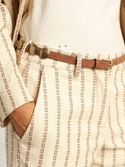 Trinidad belt in aged tan-colored leather with golden maxi studs
