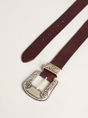 Women’s belt in burgundy leather with decorated silver buckle