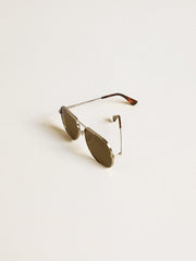 Aviator sunglasses with silver frame and green lenses