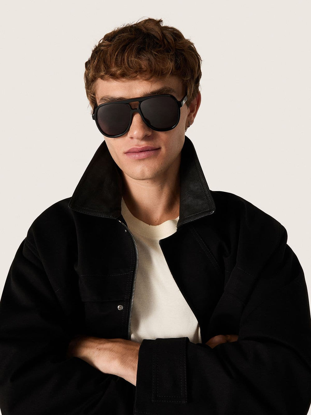 Aviator style sunglasses with black frame and lenses