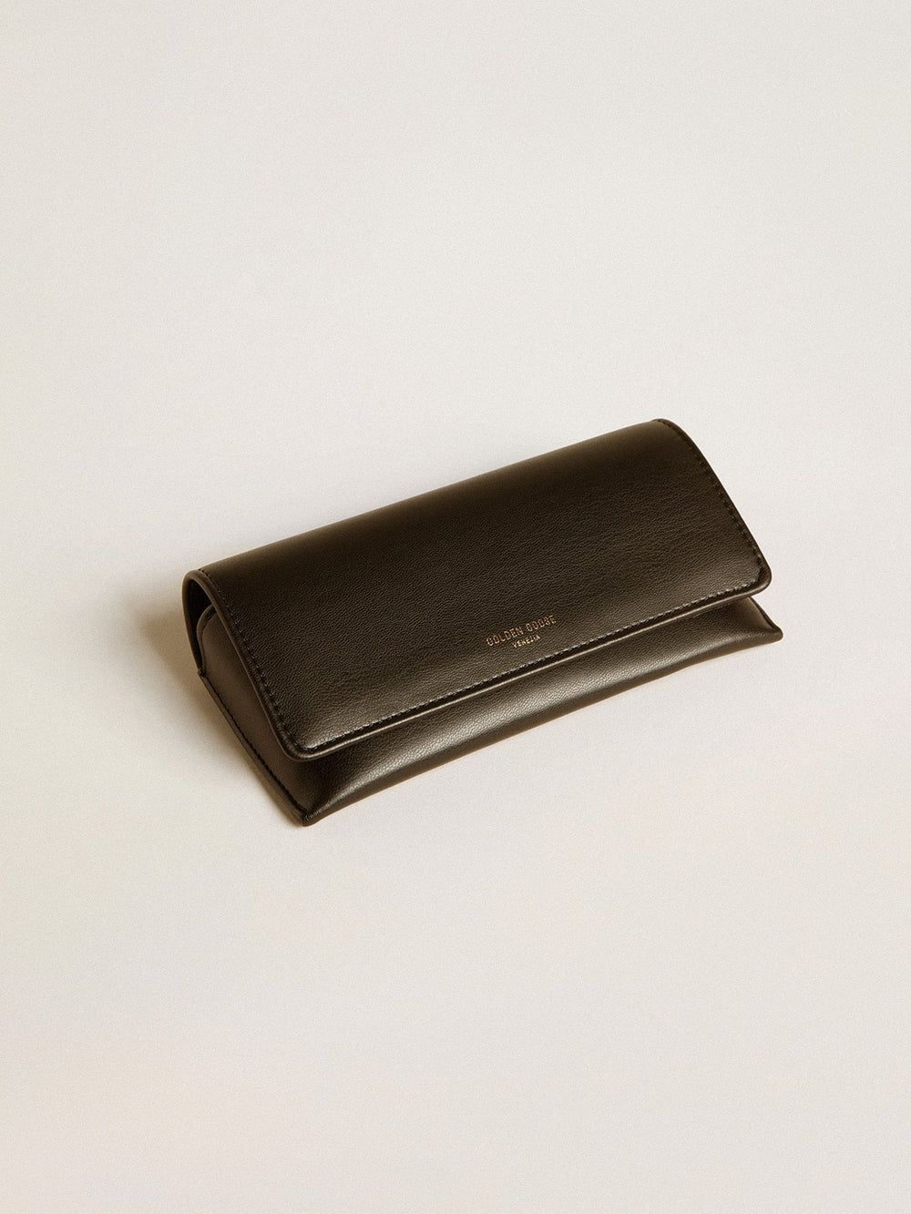 Aviator style sunglasses with black frame and lenses